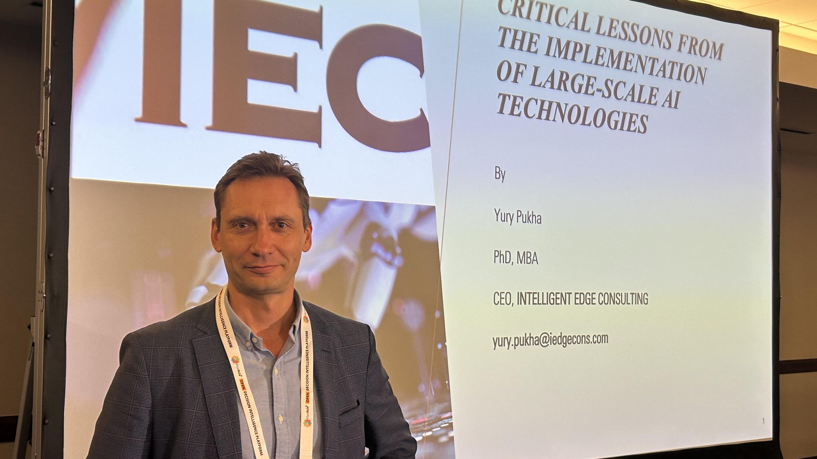 Yury Pukha presenting critical lessons from large-scale AI implementation